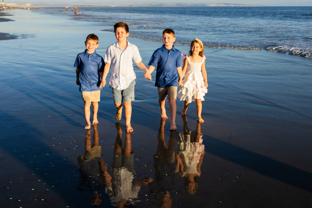 A Windy Evening with a Lifestyle Photographer San Diego Families Trust Lasting family memories captured during an extended family photography session on Coronado Beach